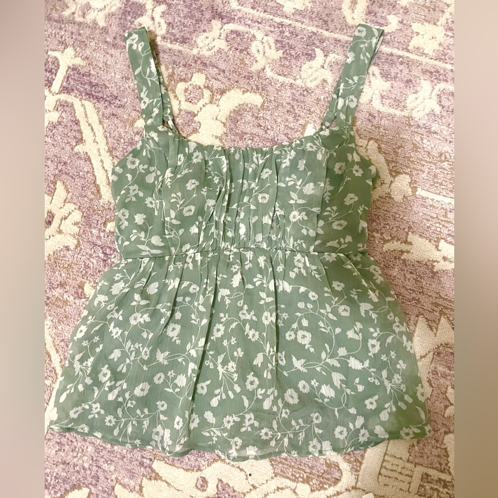 Cute going out tank top is sage greens with white flowers design